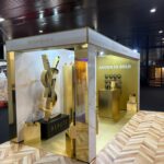YSL Beauté sustainable exhibition booth in gold with marble finishes