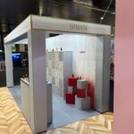 Armani modular sustainable exhibition stand with silver and red gradient finish