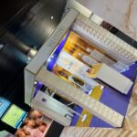 Valentino sustainable exhibition design with geometric white texture and purple tones