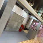 Armani modular sustainable exhibition stand with silver and red gradient finish