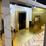YSL Beauté sustainable exhibition booth in gold with marble finishes