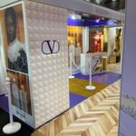 Valentino sustainable exhibition design with geometric white texture and purple tones