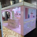 Lancôme sustainable exhibition stand in pink and gold, built with T3 modular system